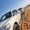 desert safari fleet SUV convoy getting ready for the sand bashing drive in the desert