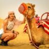 desert safari camel picture with a female tourist