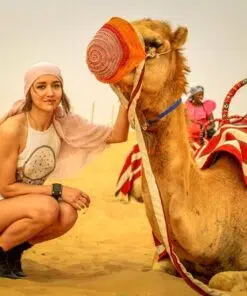 desert safari camel picture with a female tourist