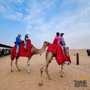 camel-caravan-riders-dubai-desert-camp with desert safari in dubai price camel ride in dubai desert safari - Website handled by mustajabhub.com