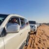 The convoy of SUV and the desert safari guides in the dubai desert