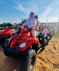 morning desert safari with quad bike in red quad on desert safari dubai