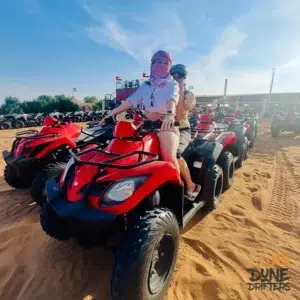 morning desert safari with quad bike in red quad on desert safari dubai