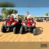 Evening Desert Safari With Quad Bike 8 guests-riding-red-quad-bikes-dubai-desert for Evening Desert Safari with Quad Bike - dubai desert experience _ website handle handle by Mustajabhub.com