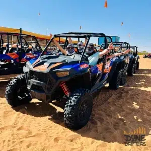 Polaris dune buggy fleet lined up ready to ride in the Dubai desert