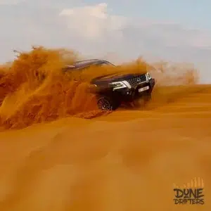 4x4 on a dune crest at Lahbab on a central pickup desert safari -safari-centralized