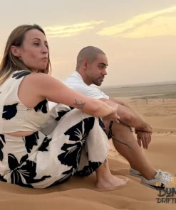 couple-watching-sunset-desert-safari-dubai - private desert safari dubai packages - website handled by mustajabhub.com