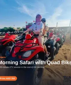 Group setting off on red quad bikes during a Dubai morning desert safari