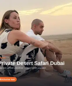 Couple watching the sunset on a private desert safari in Dubai