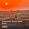 Guest walking the red dunes at sunset on a Dubai sundowner safari